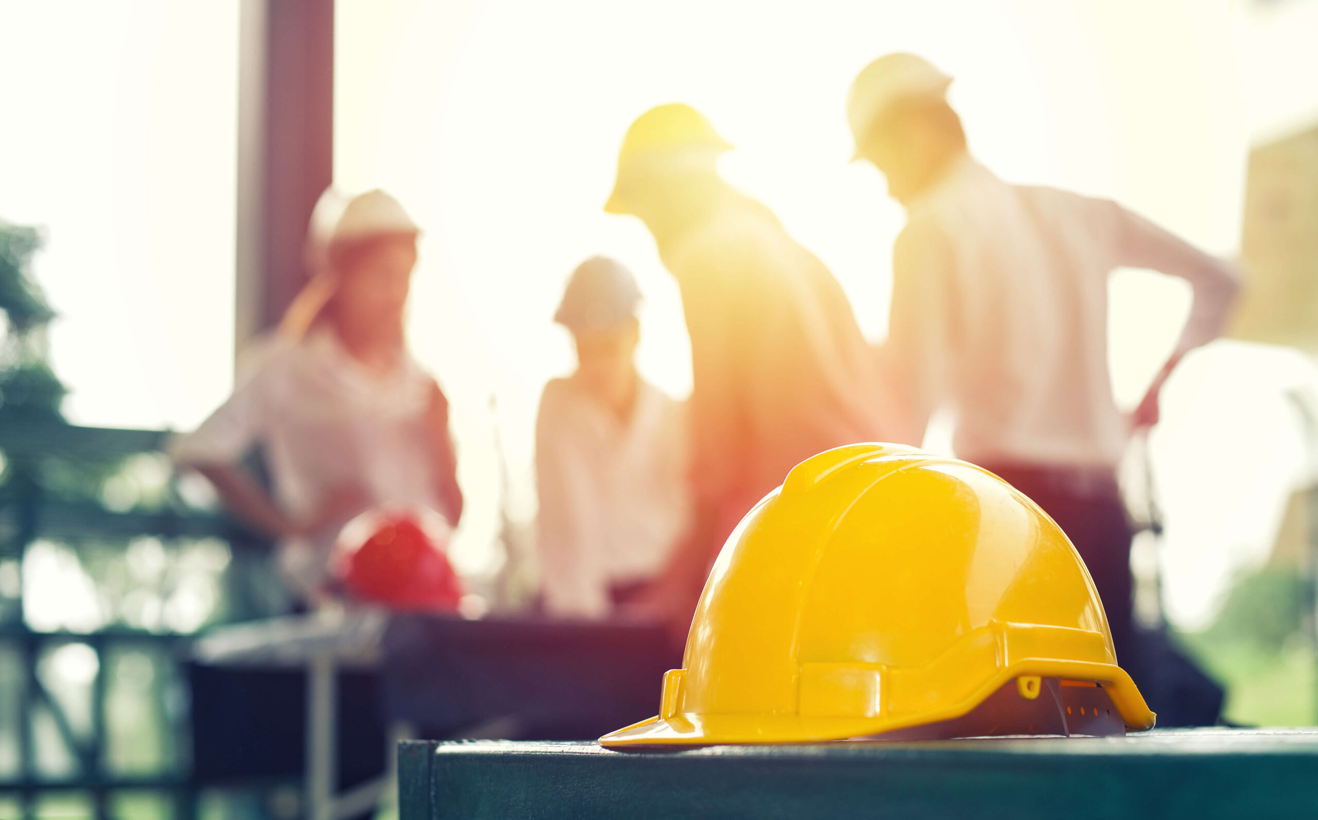 People on construction site in the background talking